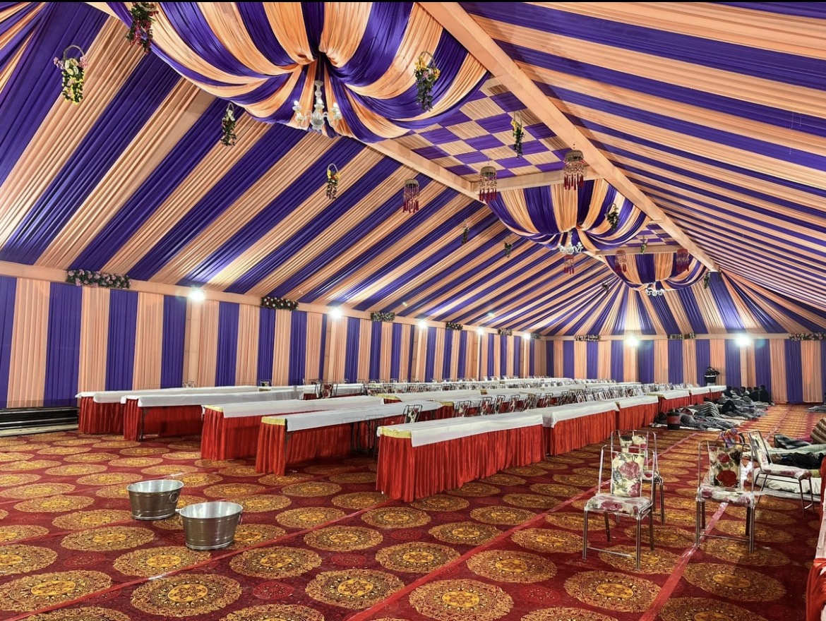 Mahakal large draped tent and dining-area setup