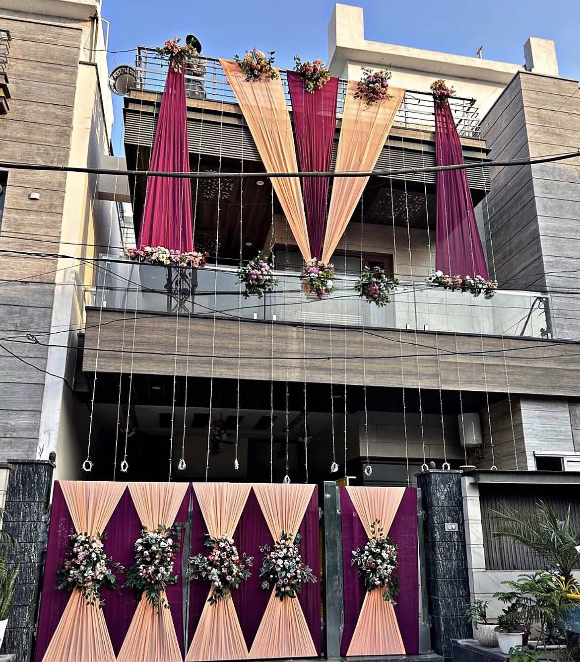 Mahakal daytime home decoration with drapes and floral arrangements